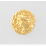 A Roman gold coin, the obverse with a portrait bust of a lady, the reverse with a figure of a winged