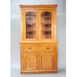 A Victorian bleached mahogany secretaire bookcase with moulded cornice, fitted shelves enclosed by