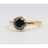 An 18ct yellow gold onyx ring size M, 3.7 grams