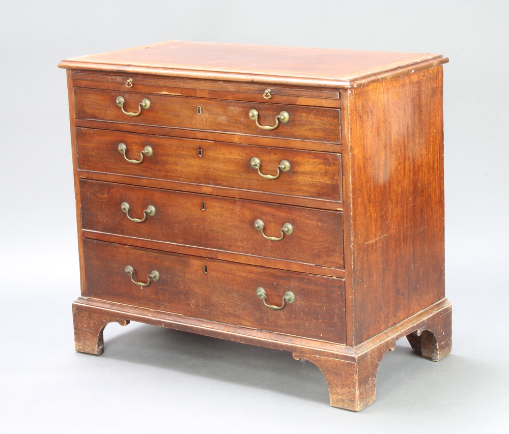 A Georgian crossbanded mahogany chest with brushing slide above 4 long graduated drawers, raised