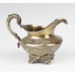 A Victorian silver cream jug with S scroll handle and scroll legs, London 1865, 9cm, 152 grams