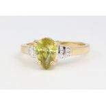 An 18ct yellow gold peridot and diamond ring, 6 grams, size T