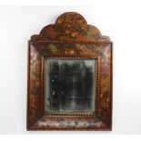 A 19th Century Dutch style rectangular bevelled plate wall mirror contained in an arched floral