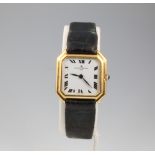 A lady's 18ct yellow gold octagonal cased Baume and Mercier wristwatch with cabochon cut sapphire