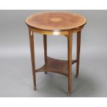 An Edwardian circular inlaid mahogany occasional table, raised on square tapered supports with