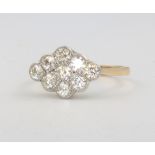 An 18ct yellow gold diamond cluster ring size M, 2.7 grams