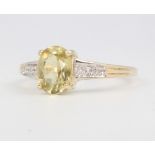 A 9ct yellow gold peridot and diamond ring 1.9 grams, size O