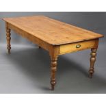 A Victorian pine kitchen table with planked top fitted 2 long drawers raised on turned supports 74cm