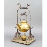 A Victorian brass and iron kettle raised on a ditto stand with spirit burner