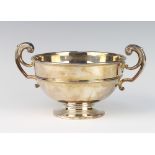 A silver 2 handled presentation trophy with fancy scroll handles 27cm, 494 grams The hallmarks are