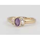 A 9ct yellow gold amethyst and diamond ring size, 3 grams, size O 1/2