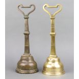 James Cartland and Sons, a pair of Victorian aesthetic movement brass door stops of club form 37cm h