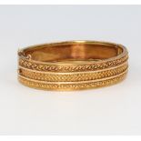 A 15ct yellow gold etruscan style bangle 16.9 grams