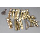 13 various Art Nouveau brass Norfolk style door latches together with 4 brass electric wall brackets