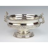 A Continental repousse silver 2 handled shallow bowl decorated with scrolls and flowers 25cm, 766