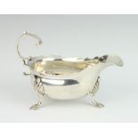 A George II silver sauce boat with S scroll handle on pad feet London 1758, 140 grams