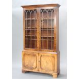 A Georgian style mahogany display cabinet, the upper section with moulded cornice, fitted shelves