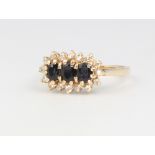 A 9ct yellow gold gem set triple cluster ring, 1.9 grams, size I