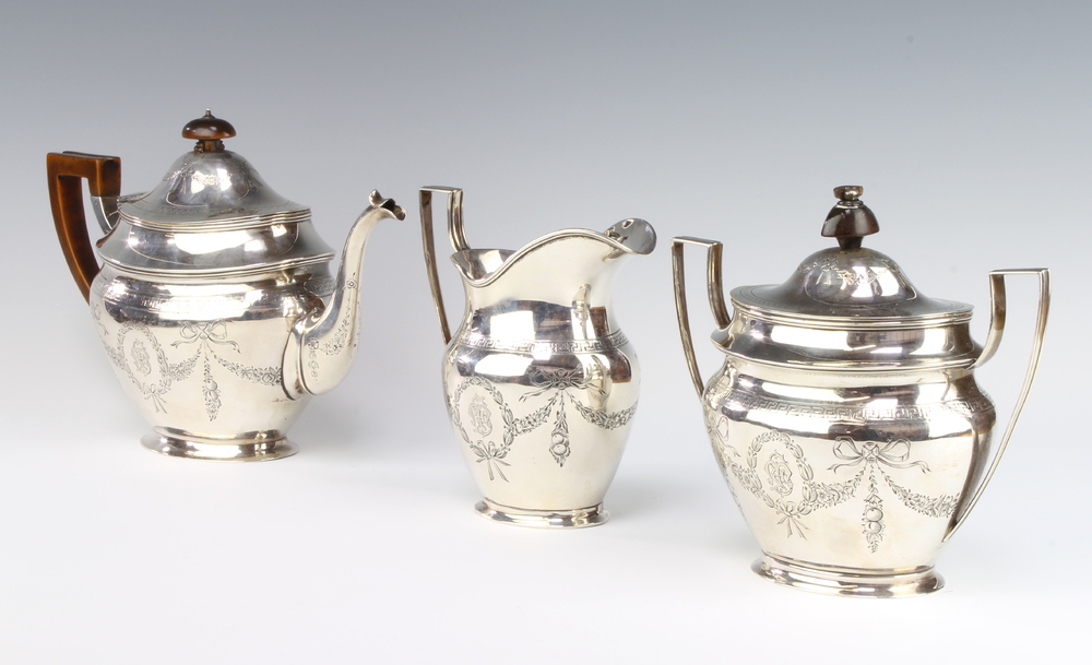 A good silver Tiffany & Co tea set with engraved floral swags, festoons and ribbons with armorial,