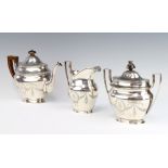 A good silver Tiffany & Co tea set with engraved floral swags, festoons and ribbons with armorial,