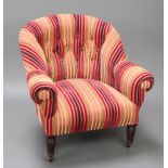 A Victorian tub back chair upholstered in red and gold striped, buttoned material