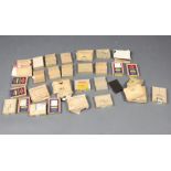 A large collection of various 1930's and 40's Kodak glass photographic plates of war damaged