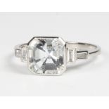 An Art Deco style platinum aquamarine and diamond ring, the centre square cut stone approx 2ct,
