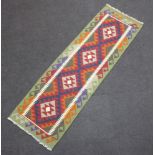 A green, tan and brown ground Maimana Kilim runner with 4 diamonds to the centre 198cm x 60cm