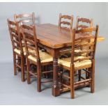 An 18th Century style oak dining suite comprising draw leaf dining table on turned and block
