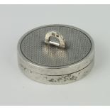 A circular silver engine turned pill box, London 1958, maker Asprey and Co, 35mm, 16 grams