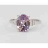 A 9ct white gold oval amethyst and diamond ring, 2.3 grams, size N 1/2