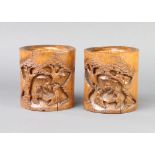 A pair of Chinese oval carved bamboo vases decorated figures 12cm x 11cm x 9cm Both vases have