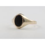 A 9ct yellow gold onyx signet ring, 1.3 grams, size L