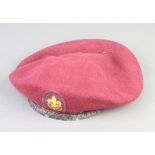 A World War Two Parachute Regiment red beret by Kangol Wear Ltd. with broad arrow and dated 1942,