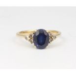 A 18ct yellow gold oval sapphire and diamond ring, the centre stone 2ct, the 6 brilliant cut