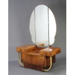 A 1930's Art Deco walnut dressing chest with arched triple plate mirror, fitted 2 short and 1 long