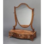 A 19th Century SHeraton style shield shaped dressing table mirror contained in a bleached mahogany
