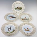 A set of 4 (and 1) Victorian ribbon plates decorated with cherubs at pursuits, signed F A Mason