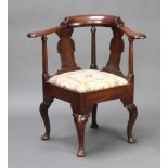 A Georgian mahogany slat back corner chair with upholstered drop in seat, raised on cabriole