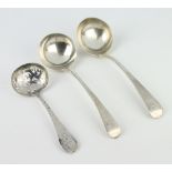A Victorian silver sifter spoon Birmingham 1868 and a pair of ladles 102 grams