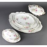 A Limoges dinner service decorated with spring flowers comprising 12 dinner plates, 10 medium