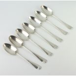 A matched set of 7 Georgian silver table spoons, mixed dates and rubbed marks, 460 grams