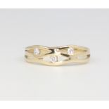 An 18ct yellow gold crossover paste set ring size P 1/2, 2.2 grams