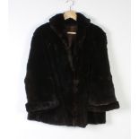 A lady's quarter length black fur coat (some moulting)