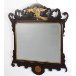 A Chippendale style rectangular plate mirror contained in an inlaid carved and pierced mahogany