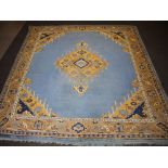 A blue and tan ground Afghan carpet with diamond central medallion within a 3 row border 379cm x