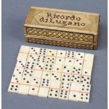 A set of 24 19th Century bone and ivory miniature dominoes contained in a straw work case, lid