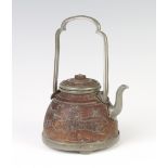 A 19th Century Chinese carved coconut wine kettle with pewter mounts, the body decorated with