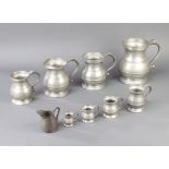 A set of 8 19th Century baluster shaped pewter measures comprising half gallon, quart, spouted