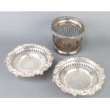 A pair of Victorian plated coasters with vinous rims and pierced borders 21cm, together with a